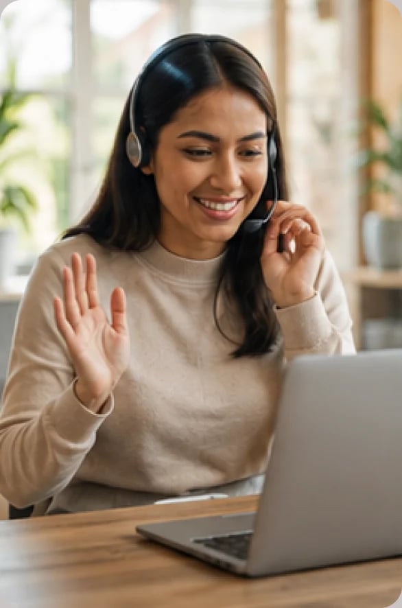 New customer smiling while joining an onboarding session on a laptop
